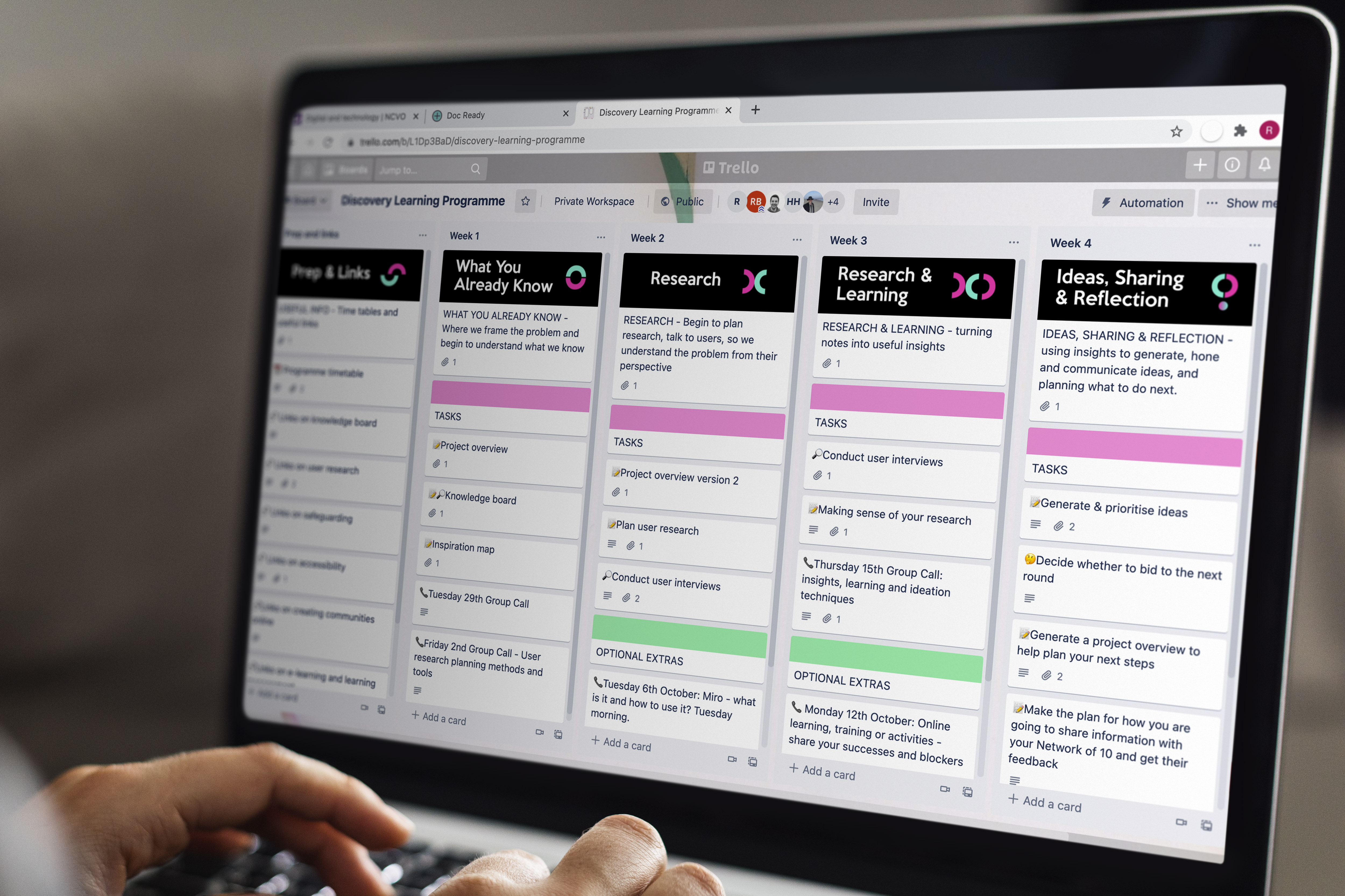A laptop showing the Discovery Learning Programme Trello board.