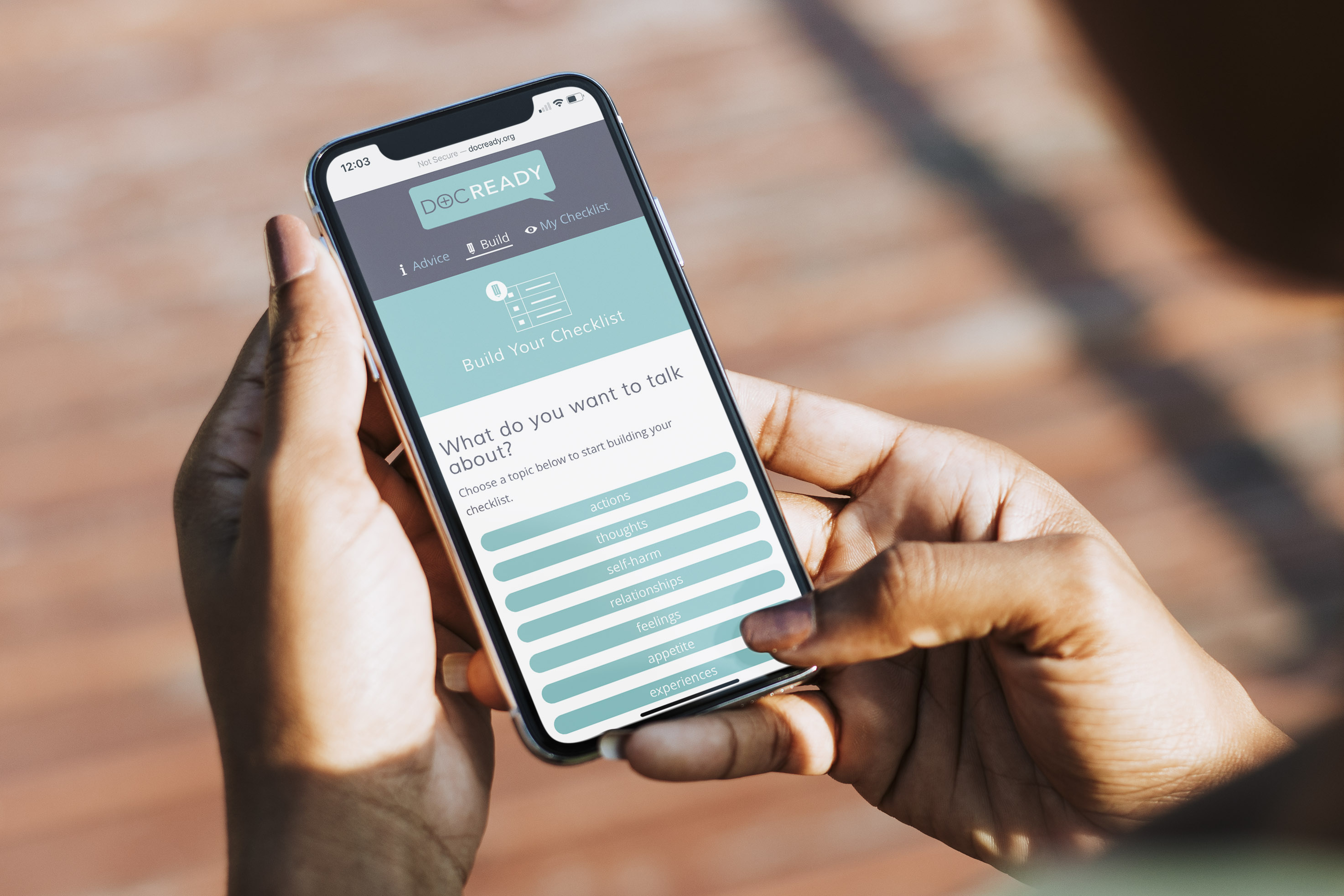 A hand holding a phone showing the Docready app with a checklist builder.